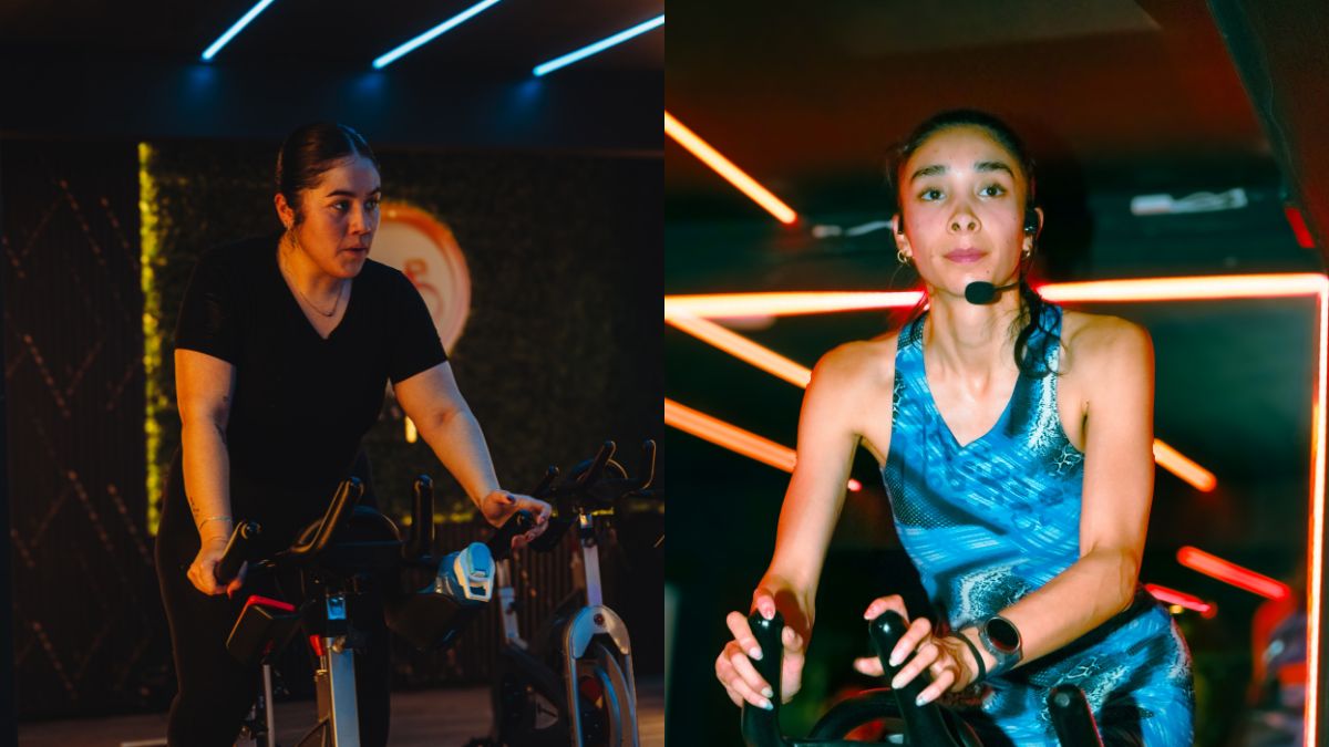 Instructora de indoor cycling motivando a los alumnos en LÚMINA